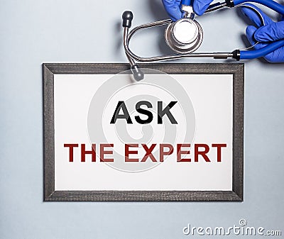 Ask the expert inscription on paper. consult your doctor Stock Photo