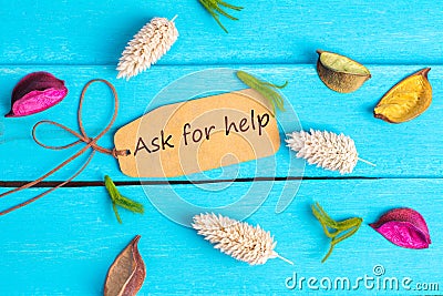 Ask for help text on paper tag Stock Photo