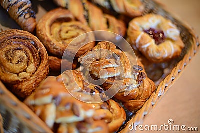 Asorted pastry in basket at breakfast serving. Selective focus Stock Photo