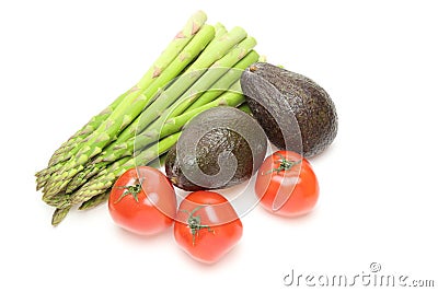 Asparagus,avocados and tomatoes in a white background Stock Photo