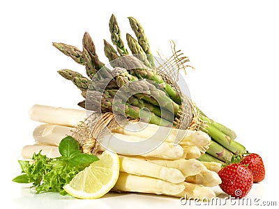 Asparagus Bundles with Strawberries on white Background Stock Photo