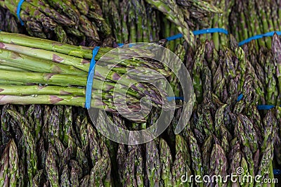 Asparagus Bundles at Vegetable Stall Closeup Stock Photo