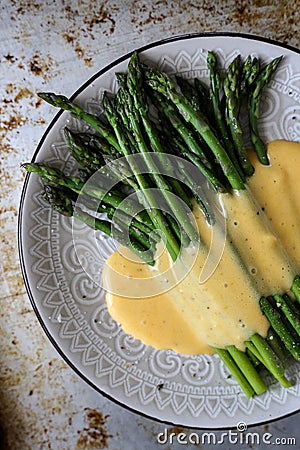 Asparagus in homemade hollandaise sauce Stock Photo