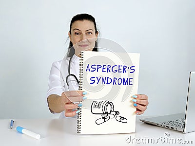 ASPERGER`S SYNDROME text in menu. Neurologist looking for something at laptop Stock Photo