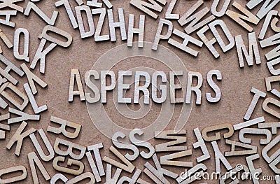 Aspergers concept, word spelled out in wooden letters Stock Photo