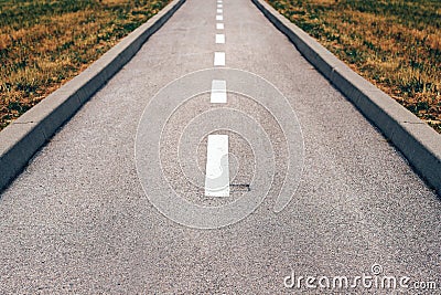 Asphalt bicycle land in diminishing perspective Stock Photo