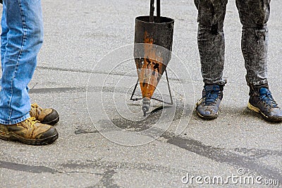 Asphalt crack filler asphalt crack repair, liquid, joint sealant joint seal concrete Stock Photo