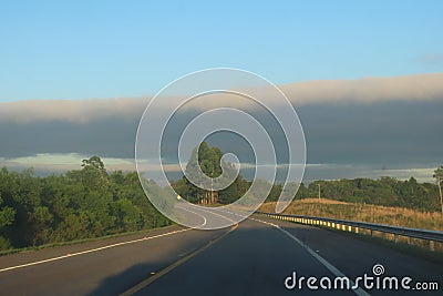 asphalt highway amidst nature Stock Photo