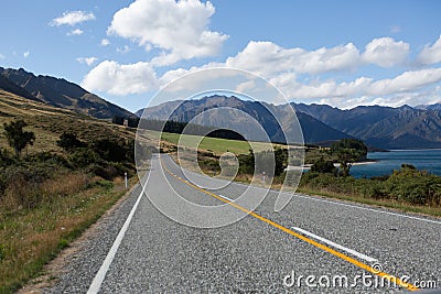 Asphalt highway curve road to mountain cook New Zealand with clo Stock Photo