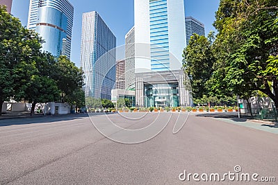 Asphalt pavement with modern urban background Stock Photo
