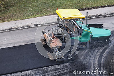 Asphalt paver machine or paver finisher Stock Photo