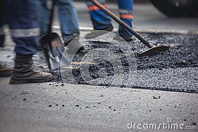 Asphalt paver machine and steam road roller during road construction and repairing works, process of asphalting and paving, Stock Photo