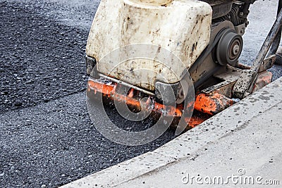 Asphalt rammer. laying the road surface Stock Photo