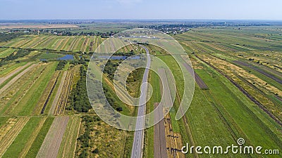 Asphalt road through agricultural fields. Fall time. aerial view Stock Photo