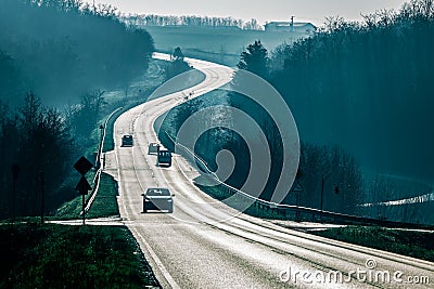 Asphalt road countryside with cars Stock Photo