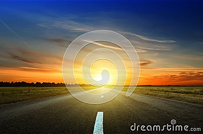 Asphalt road among the fields Stock Photo