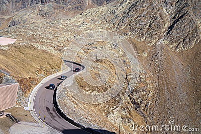 Asphalt road high in the mountains with rocky hills Stock Photo