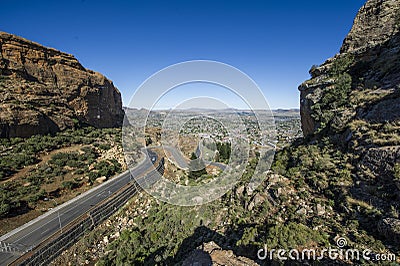 Asphalt road leading into the distance Stock Photo