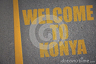 asphalt road with text welcome to Konya near yellow line Stock Photo