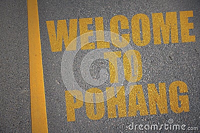 asphalt road with text welcome to Pohang near yellow line Stock Photo