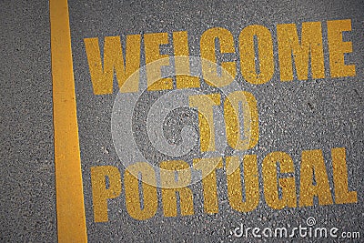 asphalt road with text welcome to portugal near yellow line. Stock Photo