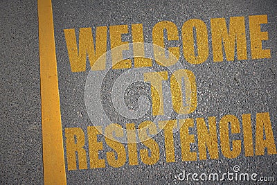 asphalt road with text welcome to Resistencia near yellow line Stock Photo