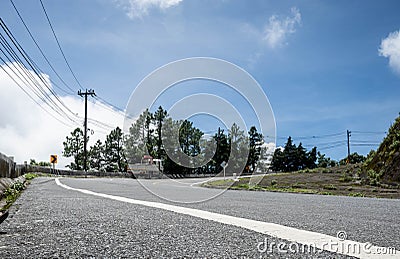 Asphalt road with the truck drives up the hill Stock Photo