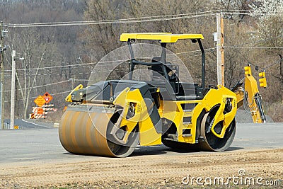 asphalt rollers rolling asphalt on the new road road construction yellow heavy new transport Stock Photo