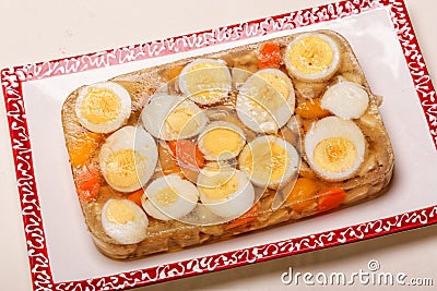 Aspic of Boiled Eggs and Chicken on Plate Stock Photo