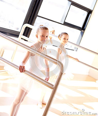 Aspiring young ballerinas practicing at the bar Stock Photo