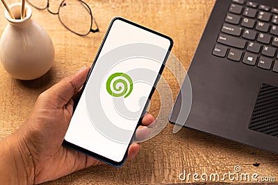 Assam, india - April 19, 2021 : Dreamstime logo on phone screen stock image. Editorial Stock Photo