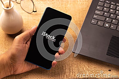 Assam, india - April 19, 2021 : iStock logo on phone screen stock image. Editorial Stock Photo