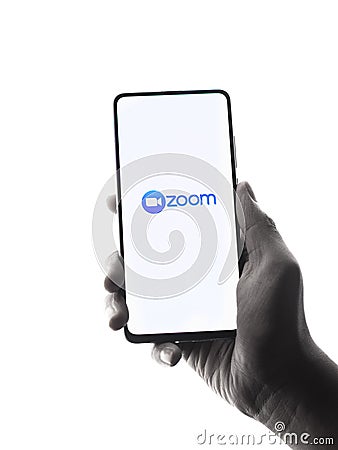 Assam, india - April 10, 2021 : Zoom logo on phone screen stock image. Editorial Stock Photo