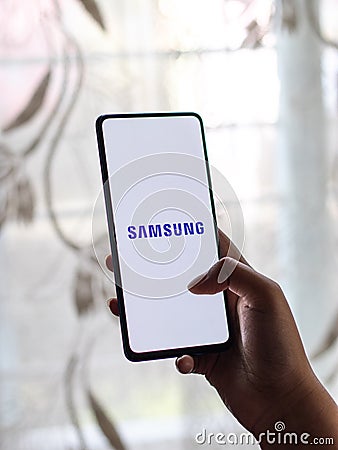 Assam, india - Augest 9, 2020 : Samsung logo on a phone screen stock image. Editorial Stock Photo