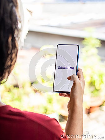 Assam, india - Augest 9, 2020 : Samsung logo on a phone screen stock image. Editorial Stock Photo