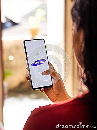 Samsung logo on a phone screen stock image. Editorial Stock Photo