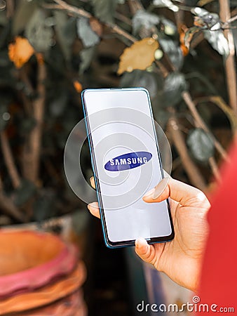 Assam, india - Augest 9, 2020 : Samsung logo on a phone screen stock image. Editorial Stock Photo