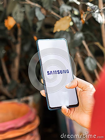 Assam, india - Augest 9, 2020 : Samsung logo on a phone screen stock image. Editorial Stock Photo