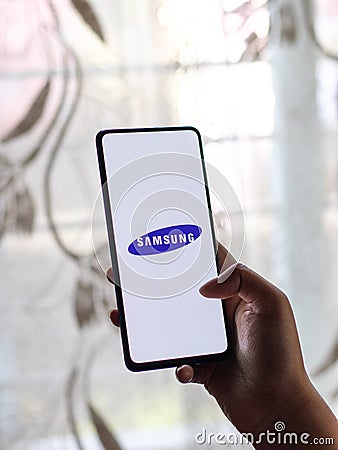 Assam, india - Augest 9, 2020 : Samsung logo on a phone screen stock image. Editorial Stock Photo