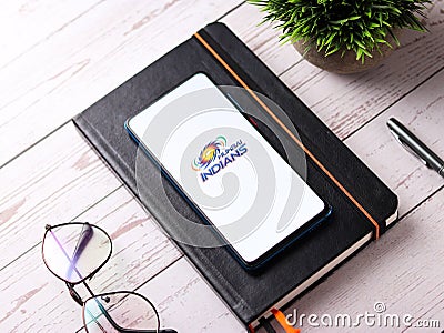 Assam, india - August 27, 2020 : Mumbai Indians logo on phone screen stock image. Editorial Stock Photo