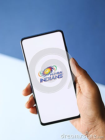 Assam, india - August 27, 2020 : Mumbai Indians logo on phone screen stock image. Editorial Stock Photo