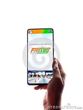Assam, india - March 10, 2021 : FASTag logo on phone screen stock image. Editorial Stock Photo