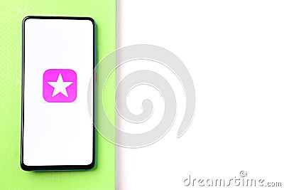 Assam, india - March 30, 2021 : iTunes Store logo on phone screen stock image. Editorial Stock Photo