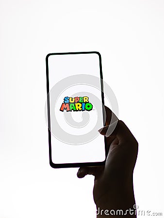 Assam, india - September 24, 2020 : Super Mario logo on phone screen stock image. Editorial Stock Photo