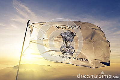 Assam state of India flag textile cloth fabric waving on the top sunrise mist fog Stock Photo