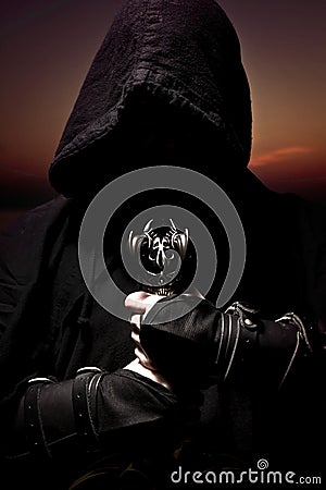 Assassin with sword Stock Photo