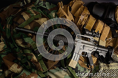 Assault rifle, pistol, grenade with tactical chest rigs and ammunition Stock Photo