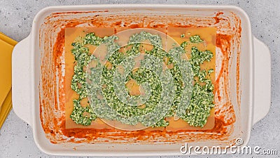 Assemble the lasagna. Spinach lasagna step by step recipe Stock Photo