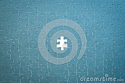 Assembled puzzles, folded background of mosaic pieces, no last element, concept of solving a difficult problem, selection of the o Stock Photo
