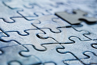 Assembled puzzles in visual perspective. Macro. Selective focusing. Shallow depth of field. Close-up Stock Photo